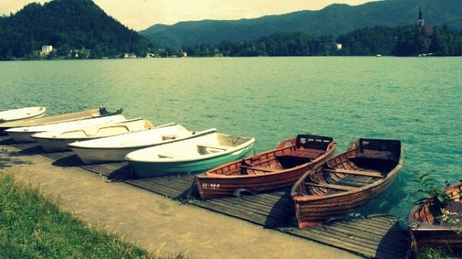Boats Await Passengers on the Shores of Lake Bled, Slovenia