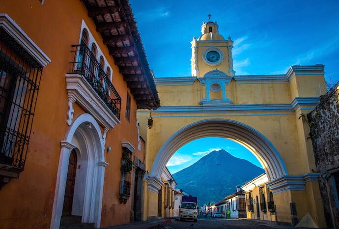 The center fountain in Parque Central in Antigua Guatemala at night. Famous  for its well-preserved Spanish baroque architecture as well as a number of  ruins from earthquakes, Antigua Guatemala is a UNESCO