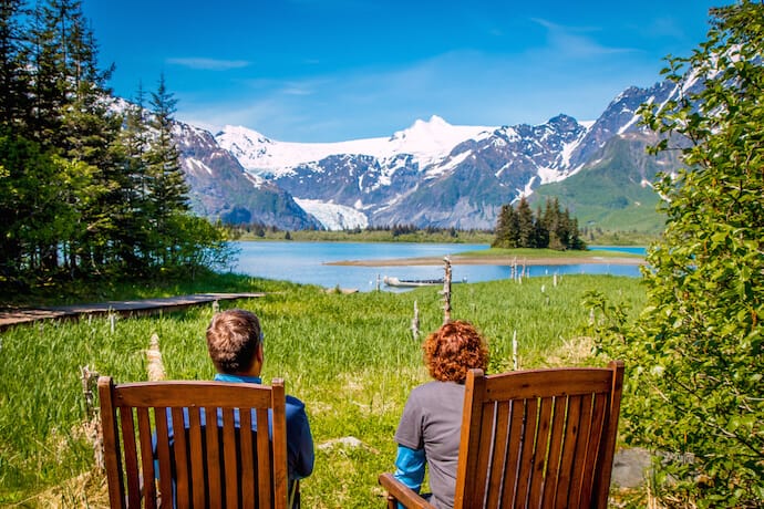 Couple soaking in the scenery at Kenai Fjords Glacier Lodge