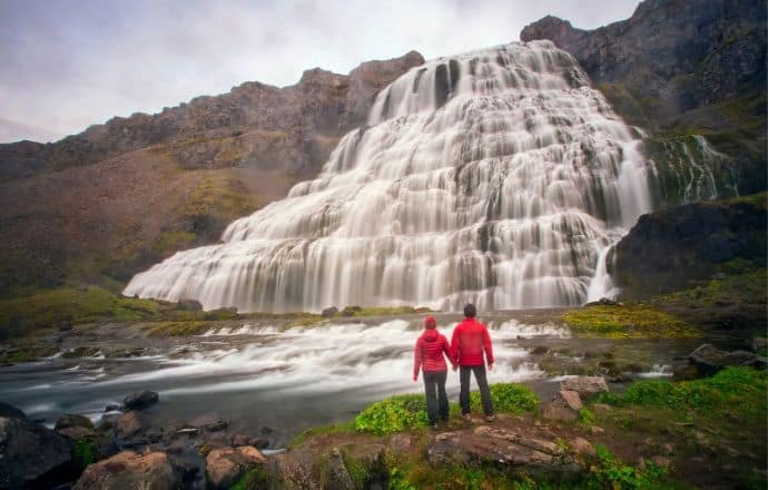 hidden gems in Europe -Couple at Dynjandi Waterfall Iceland