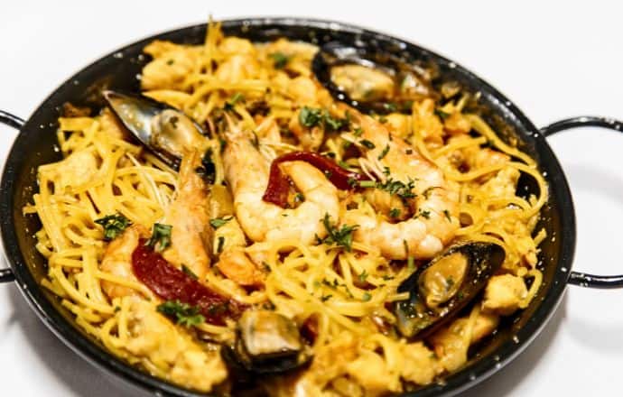 best European food cities - Spanish seafood Fideua