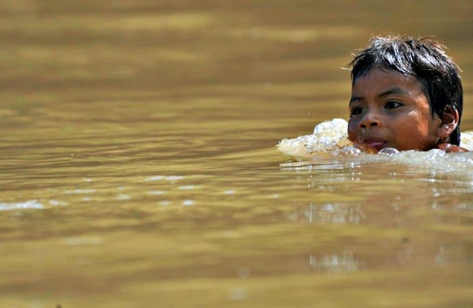 Ecuadorian Amazon Rain Forest Huaorani Child swimming