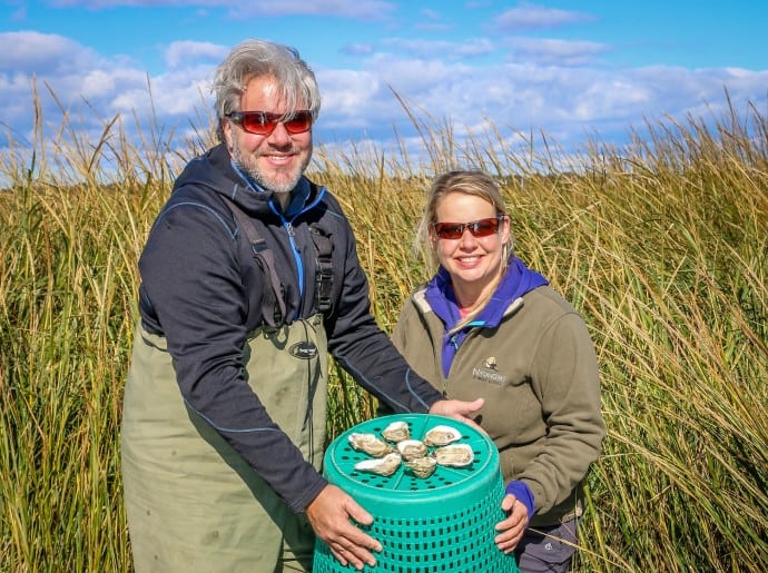 Bret and Mary of Green Global Travel with Pleasure House Oysters in Virginia Beach