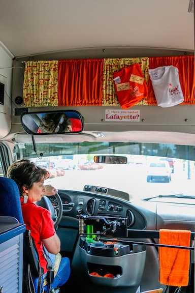 Marie Ducote Comeaux Driving the Cajun Food Tours Mini-Bus