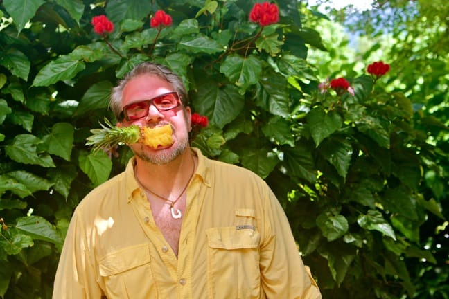 Bret from Green Global Travel Enjoying Fresh Pineapple in Tahiti