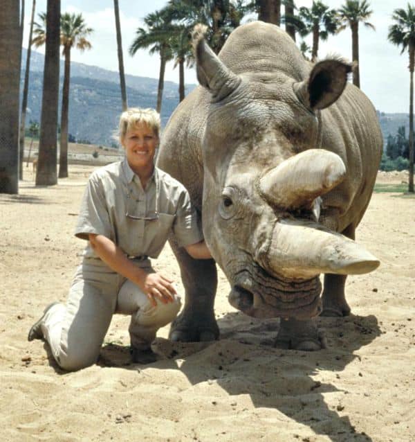 Joan Embrey at the San Diego Zoo with an endangered Rhino