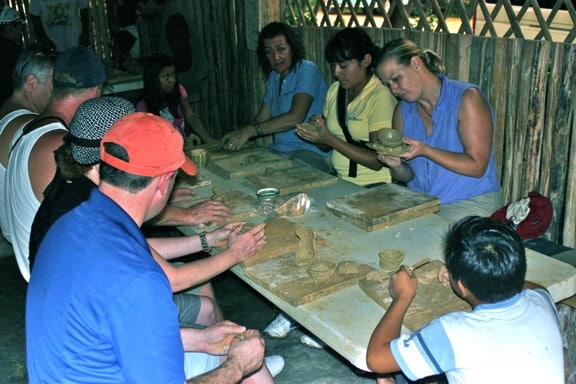 Tourists at a Mayan Pottery School in Coba, Mexico