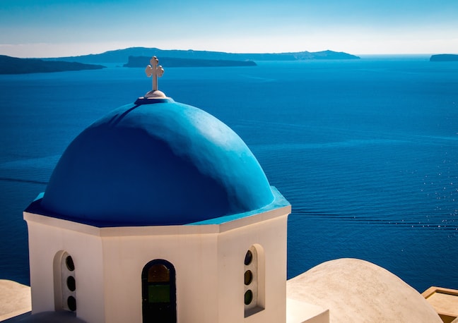 Traditional white buildings facing Mediterranean Sea in Oia