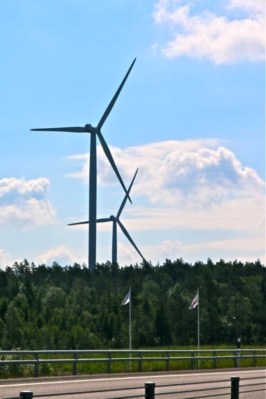 Wind Turbines Dot West Sweden's Highways