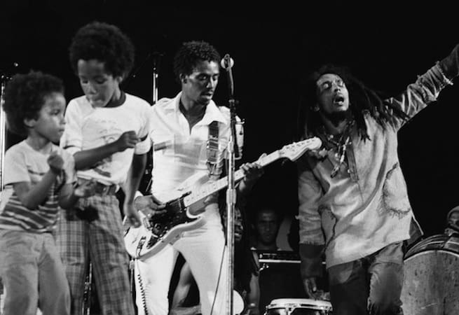 Ziggy Marley dancing onstage with Bob Marley