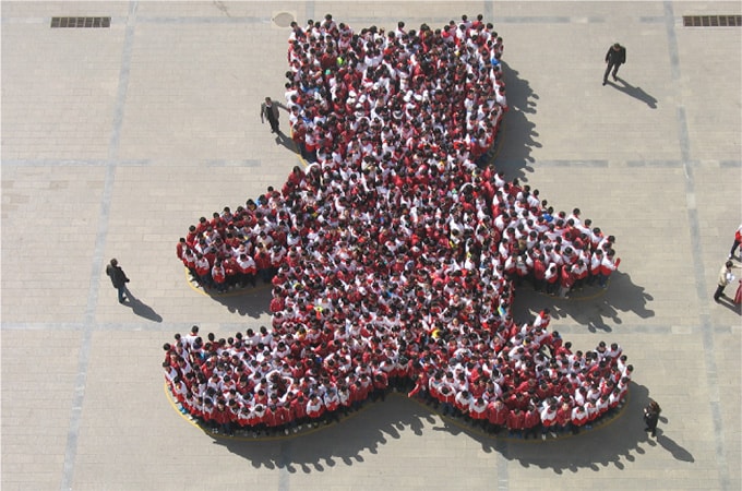 Beijing Schoolkids Form Giant Bear for Moon Bear Week